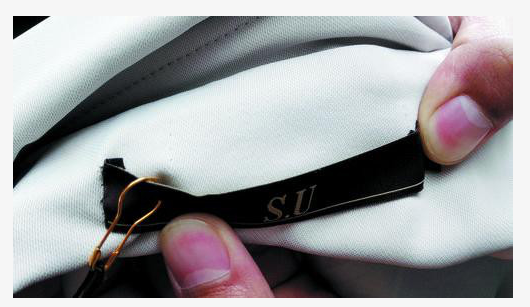 一件衣服两个商标 海口消费者买569元大衣买出烦恼